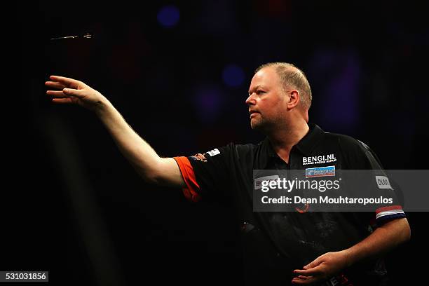 Raymond van Barneveld of the Netherlands plays a shot in his match against Peter Wright of Scotland during the Darts Betway Premier League Night 15...