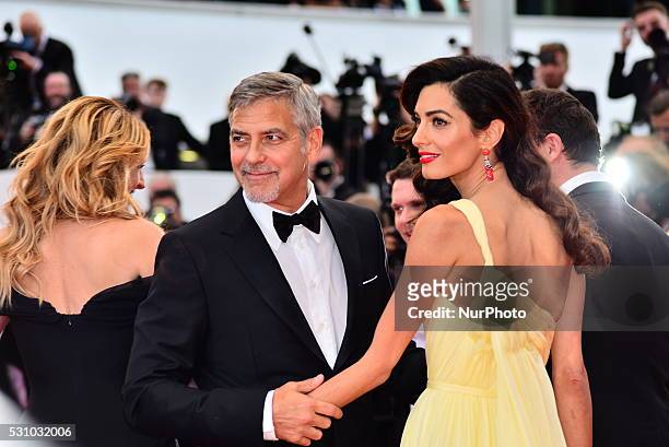 Actor George Clooney and his wife Amal Clooney attend the 'Money Monster' premiere during the 69th annual Cannes Film Festival at the Palais des...