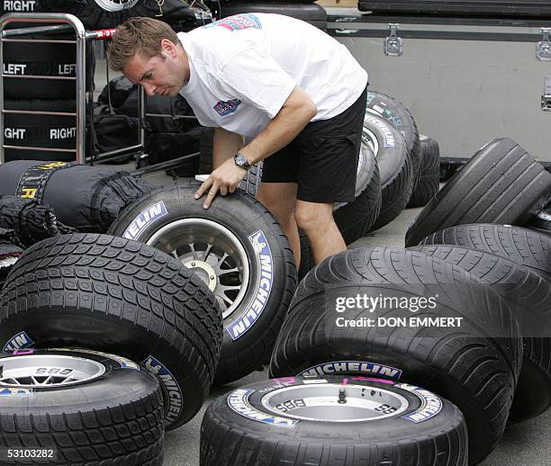 Technician for BAR-Honda puts Michelin tires away during the US Grand Prix at the Indianapolis Motor Speedway 19 June 2005. None of the F1 teams that...