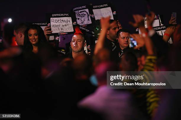Peter Wright of Scotland looks on before he plays Raymond van Barneveld of the Netherlands during the Darts Betway Premier League Night 15 at...