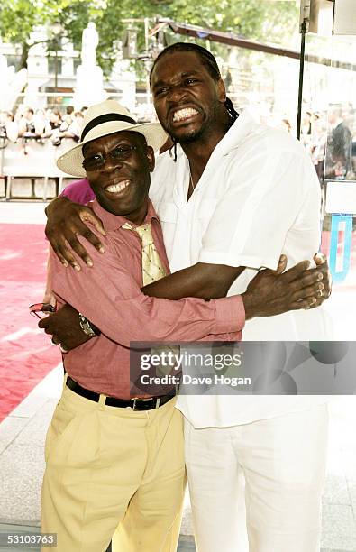 Olympic super-heavyweight champion Audley Harrison and his father arrive for the UK premiere of Tom Cruise's new movie "War Of The Worlds" at the...