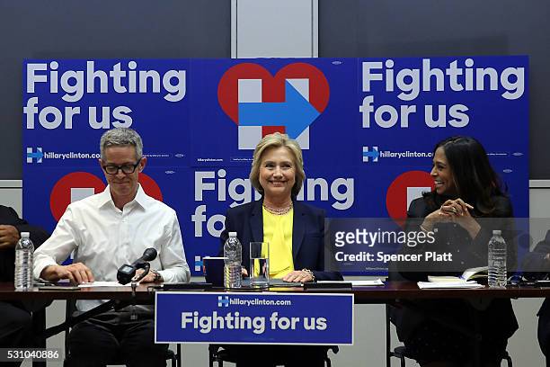 Democratic presidential front-runner Hillary Clinton speaks with a coalition of HIV/AIDS activists at her Brooklyn Campaign Headquarters on May 12,...