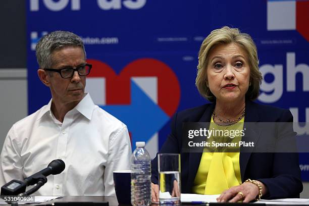 Democratic presidential front-runner Hillary Clinton speaks with a coalition of HIV/AIDS activists at her Brooklyn Campaign Headquarters on May 12,...