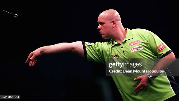 Michael van Gerwen of the Netherlands plays a shot in his match against Phil 'The Power' Taylor of England during the Darts Betway Premier League...