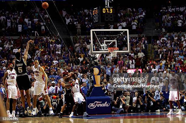 Robert Horry of the San Antonio Spurs makes a three-point shot to put the Spurs ahead of the Detroit Pistons 96-95 in the final seconds of overtime...