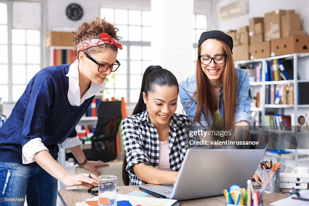 Three Young Female Colleagues Having Fun At Workplace High-Res Stock ...