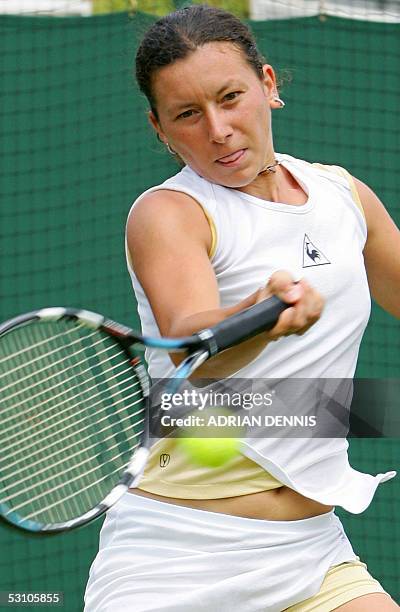 United Kingdom: Antonella Serra Zanetti from Italy hits a shot to Patty Schnyder Switzerland during their first round match against at the 119th...