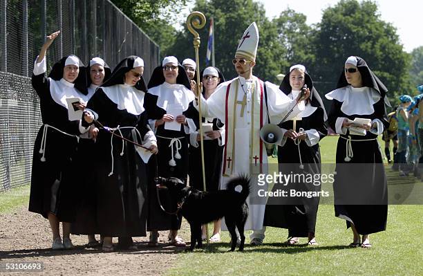 Players and fans of the TBWA Hotshots dress as nuns and priests during the Bauer Agency Cup in Venlo on June 18, 2005 in Venlo, Netherlands. The Pope...