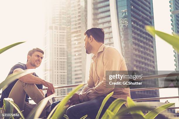 friends talking outside their office building - conservative stock pictures, royalty-free photos & images