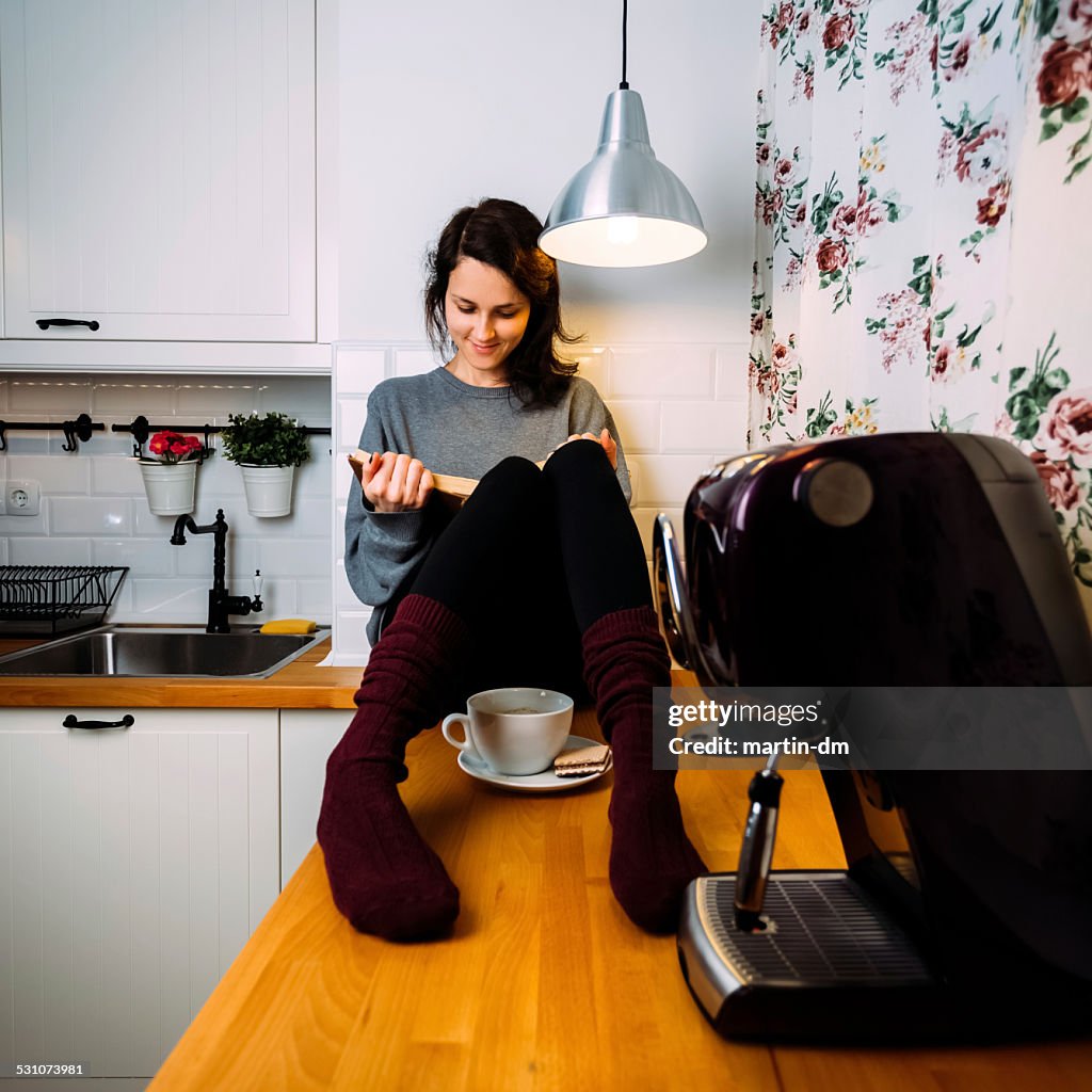 Girl reading a book at home