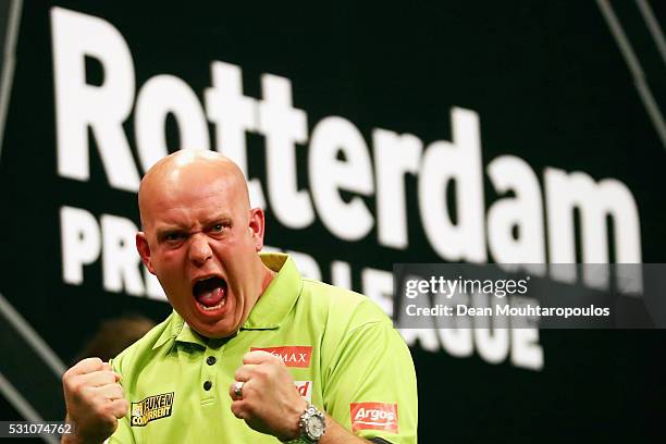 Michael van Gerwen of the Netherlands celebrates victory in his match against Phil 'The Power' Taylor of England during the Darts Betway Premier...