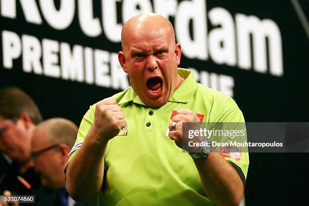 Michael van Gerwen of the Netherlands celebrates victory in his match against Phil 'The Power' Taylor of England during the Darts Betway Premier...