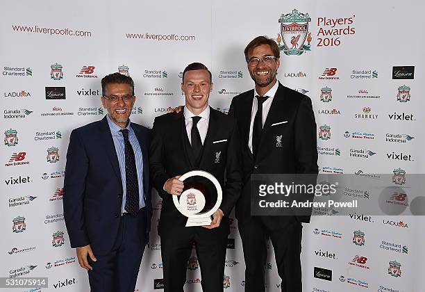 Brad Smith of Liverpool poses with the Academy players player of the season award with Jurgen Klopp and Raj Luthra at the Liverpool FC End of Season...