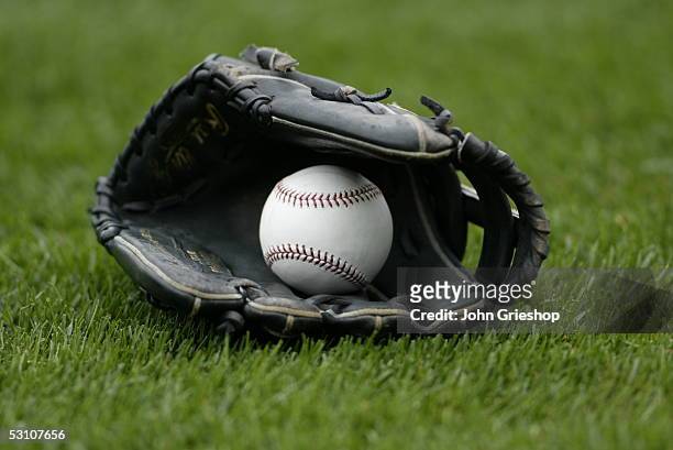 Glove and baseball are pictured before the game between the Pittsburgh Pirates and the Florida Marlins at PNC Park on May 30, 2005 in Pittsburgh,...