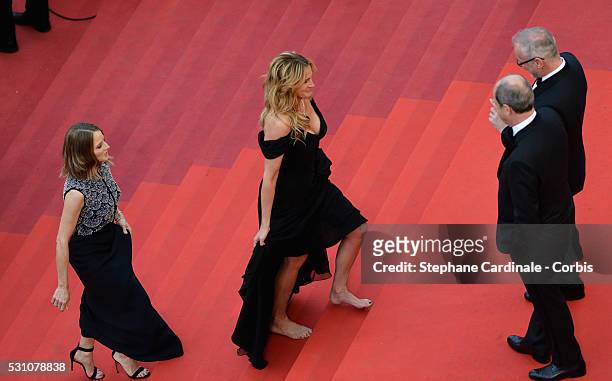 Producer Jodie Foster, and actress Julia Roberts, walking bare foot, attend the "Money Monster" premiere during the 69th annual Cannes Film Festival...