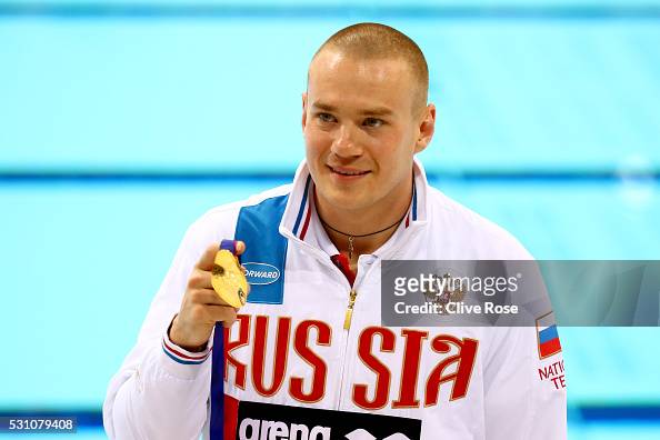 Evgenii Kuznetsov of Russia poses with his gold medal after winning ...