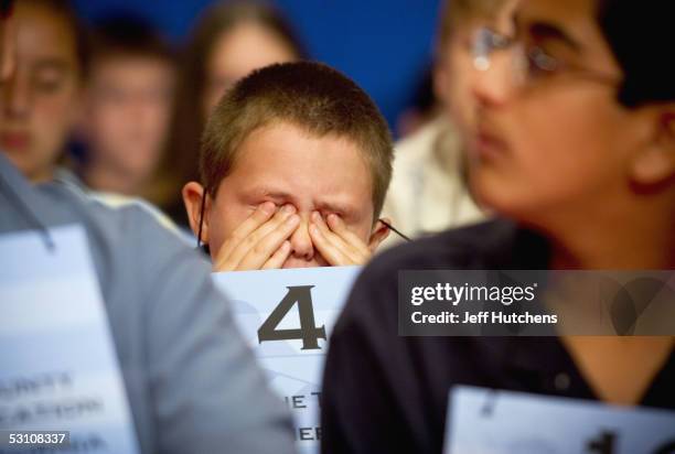 Ronnie Cowsert a fifth grader from Port Saint Lucie, Florida, reacts to misspelling his first word of the oral competition in the Grand Hyatt Hotel...