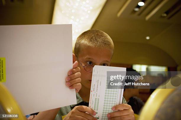 Evan Zachary Lawler a fifth grader from Garden Elementary School in Tulare, California, studies his answer key during the written portion of the...