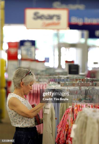 Susan Riley shops for women's clothing in a newly opened Sears Essentials store June 20, 2005 in Palatine, Illinois. This Sears Essentials, a...