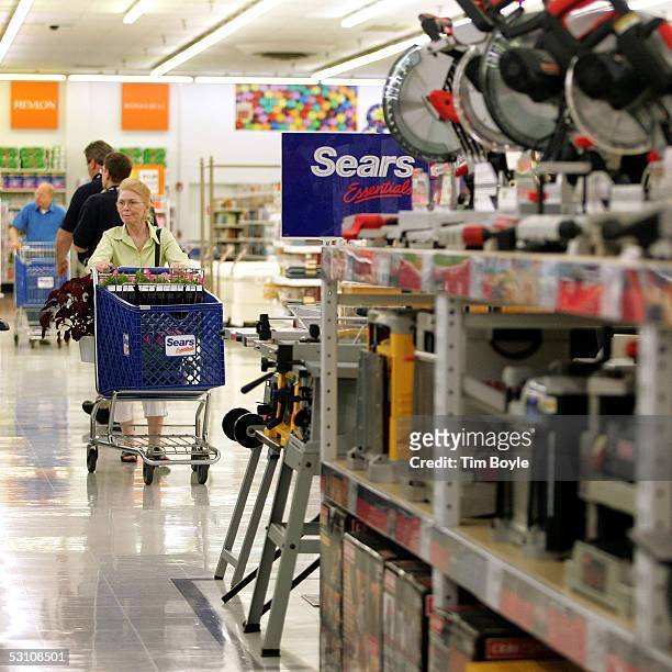 Shoppers browse near Craftsman tools in a newly opened Sears Essentials store June 20, 2005 in Palatine, Illinois. This Sears Essentials, a remodeled...