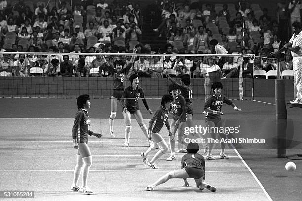 Japanese players fail to receive the ball in the Volleyball Woman's semi final match between Japan and China during the Los Angeles Summer Olympic...