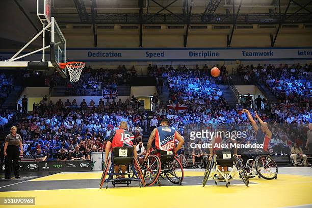 United States player attempts a free throw during action against the United Kingdom at the Invictus Games Orlando 2016 Wheelchair Basketball Finals...