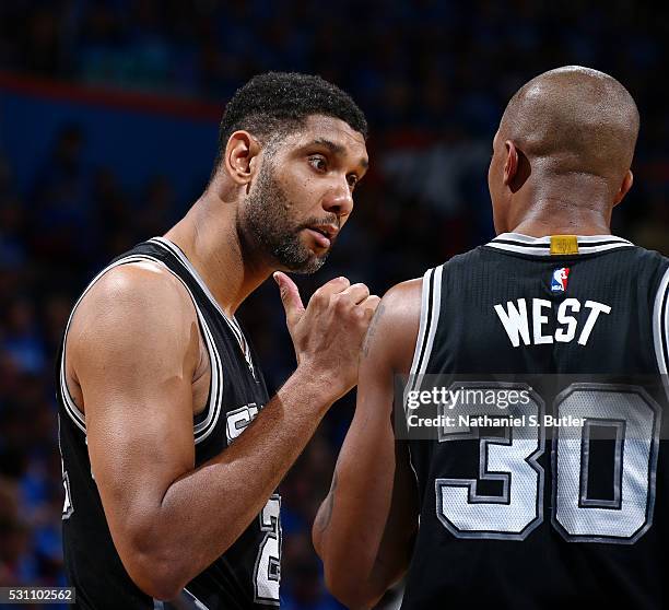 Tim Duncan of the San Antonio Spurs and David West of the San Antonio Spurs talk during the game against the Oklahoma City Thunder in Game Six of the...