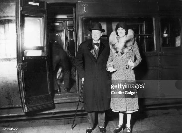 British statesman Winston Churchill and his wife Clementine arrive at Waterloo Station in London, after a visit to the United States, November 1929.
