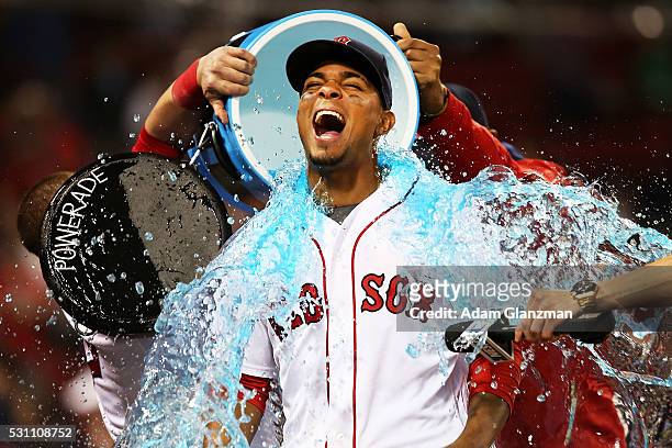 Xander Bogaerts of the Boston Red Sox has Powerade dumped on him after the victory over the Houston Astros at Fenway Park on May 12, 2016 in Boston,...