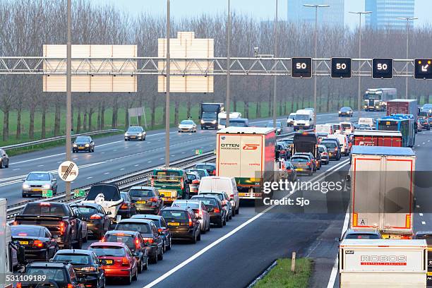 traffic jam on the highway - trucks on queue stock pictures, royalty-free photos & images