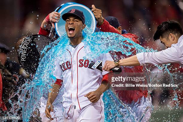 Xander Bogaerts of the Boston Red Sox reacts as a tub of Powerade is poured on him following a victory against the Houston Astros on May 12, 2016 at...