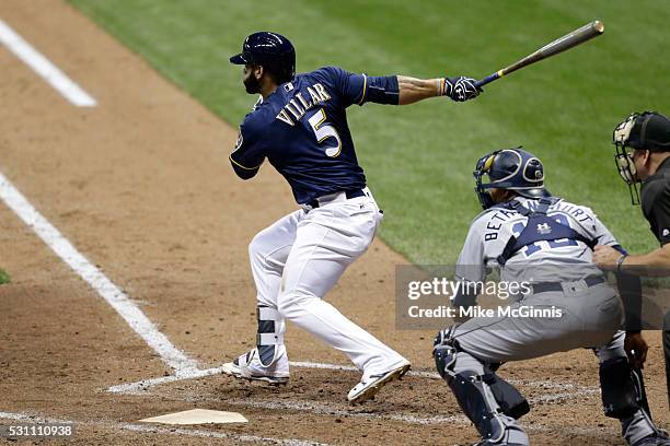 Jonathan Villar of the Milwaukee Brewers hits a single in the eighth inning against the San Diego Padres at Miller Park on May 12, 2016 in Milwaukee,...