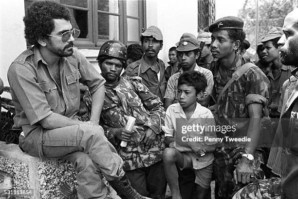 Relaxed Jose Ramos-Horta age 25 talks to and encourages Fretilin freedom fighters at Bobanaro in western East Timor as they are encountering the...