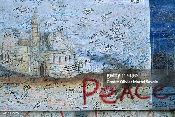 peace wall in shankill district of belfast - irish murals stock pictures, royalty-free photos & images