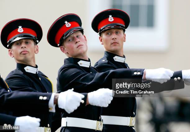 Prince Harry marches with fellow army cadets at Sandhurst Royal Military Academy on June 21, 2005 in Sandhurst, England.
