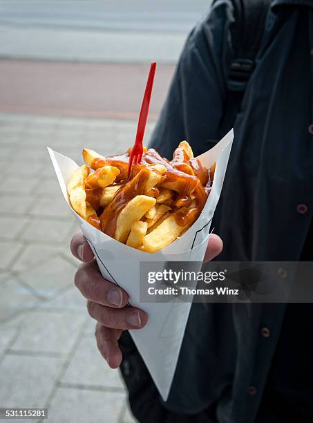 frech fries with curry ketchup - fast food french fries stock pictures, royalty-free photos & images