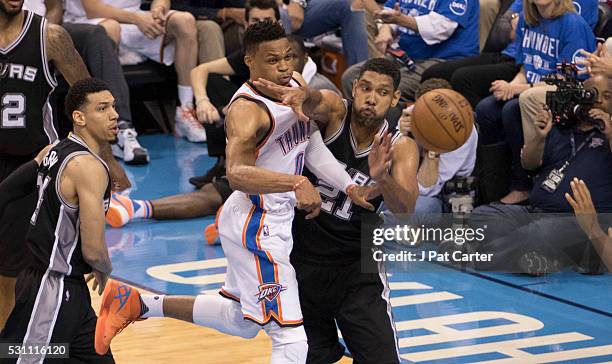 Tim Duncan of the San Antonio Spurs forces Russell Westbrook of the Oklahoma City Thunder to pass the ball off during the second half of Game Six of...