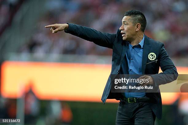 Ignacio Ambriz coach of America gives instructions to his players during the quarter finals first leg match between Chivas and America as part of the...