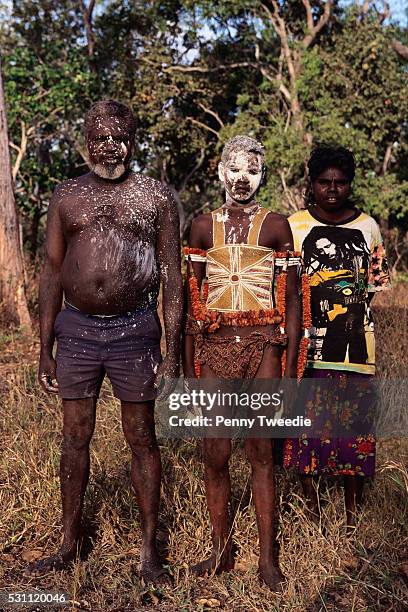 aboriginal boy preparing for initiation ceremony - native australian plants stock-fotos und bilder