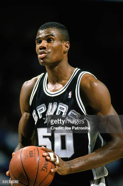 David Robinson of the San Antonio Spurs readies for the play during the game circa 1989 -1990 in Dallas, Texas.