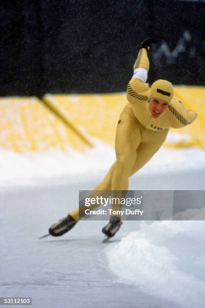Speed skater Eric Heiden makes his way around a bend tucking low with both arms behind his back during the1980 Winter Olympic games in February 1980...