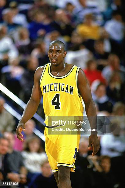 University of Michigan star forward Chris Webber strolls upcourt during a game against the University of Minnesota Golden Gophers on February 20,...