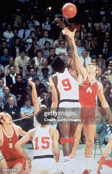 Basketball team battles for the tip off against the Russia basketball team on September 10, 1972 in Munich, Germany. The Russia won this...