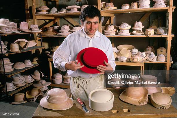 hat maker showing wares - guy carcassonne stock pictures, royalty-free photos & images