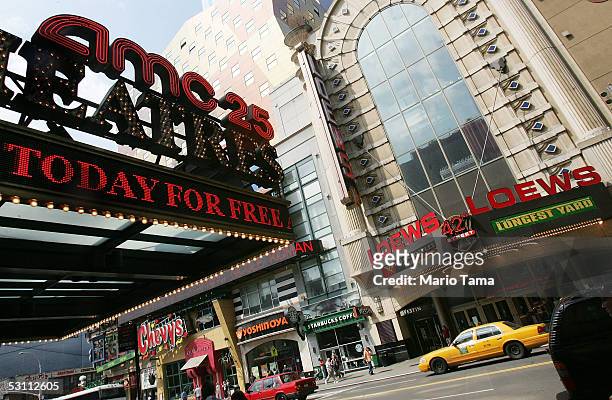 Loews movie theater stands across the street from an AMC theater in Times Square June 21, 2005 in New York City. AMC Entertainment Inc. Announced...