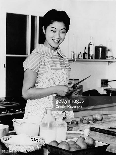 Takako, Princess Suga, the youngest daughter of Emperor Hirohito of Japan, preparing a meal days before her marriage to financial analyst Hisanaga...
