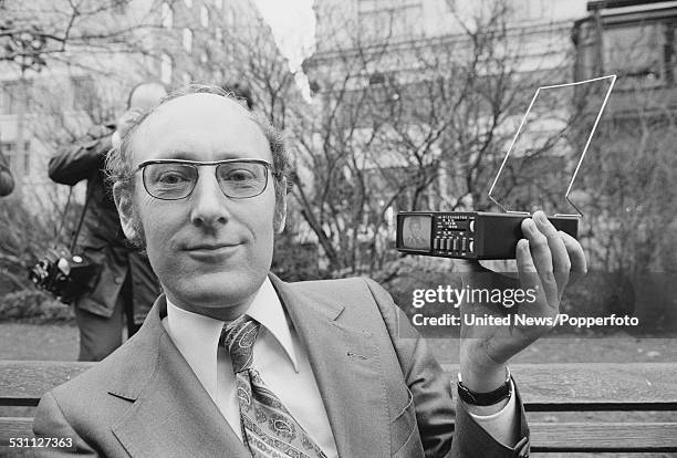 British inventor and entrepreneur, Clive Sinclair pictured holding a Sinclair MTV1 Microvision pocket TV in London on 10th January 1977.