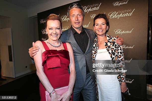 Mads Mikkelsen and his wife Hanne Jacobsen and Caroline Scheufele arrive at the Chopard Trophy Ceremony at the annual 69th Cannes Film Festival at...