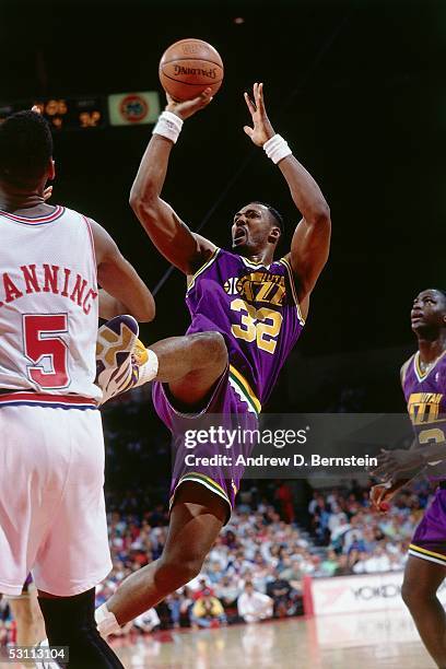 Karl Malone of the Utah Jazz shoots a fall away jumpshot against the Houston Rockets at the Summit circa 1991 in Houston, Texas. NOTE TO USER: User...