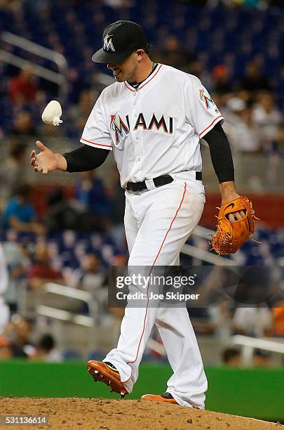 Starting pitcherJose Fernandez of the Miami Marlins pauses between pitches against the Milwaukee Brewers at Marlins Park on May 9, 2016 in Miami,...